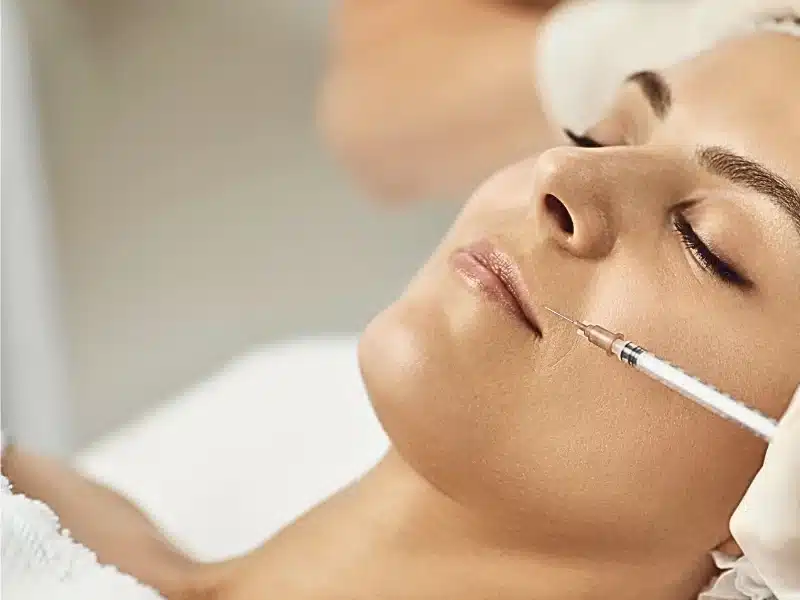 dermal filler being injected to patients face
